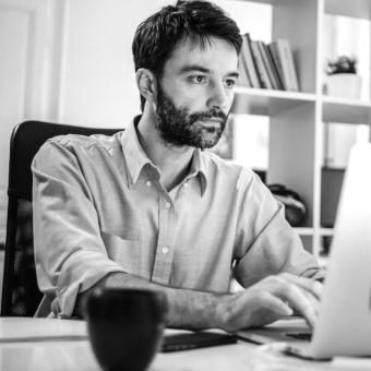 Determined businessman working on his computer