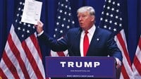 Washington, DC / USA - June 16, 2015: Donald Trump's Presidential Announcement Speech, holding and showing paper documents evidence to the press. - Stock Editorial Photography