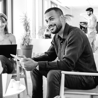 Man sitting in a lounge with a tablet device